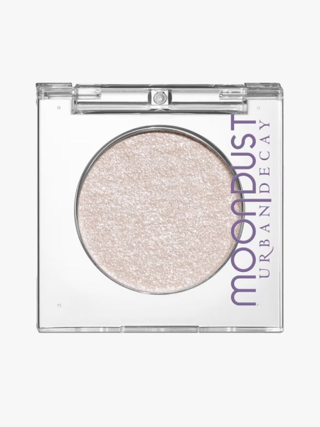 Urban Decay Moondust Eyeshadows in branded component on a light gray background